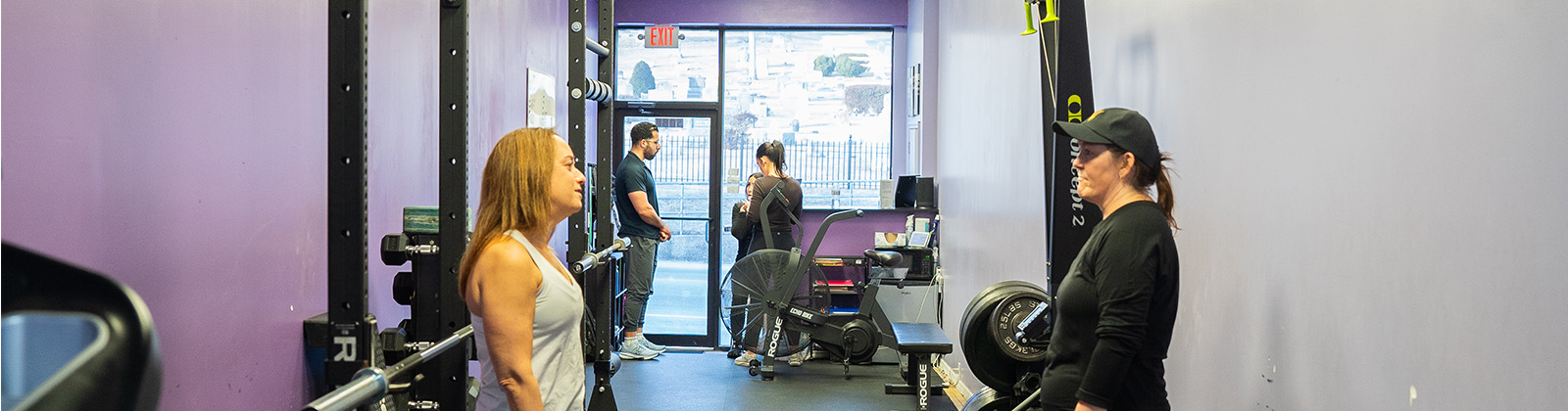 A shot of a few coaches and personal training clients inside of the Brains and Brawn gym in Huntington, New York